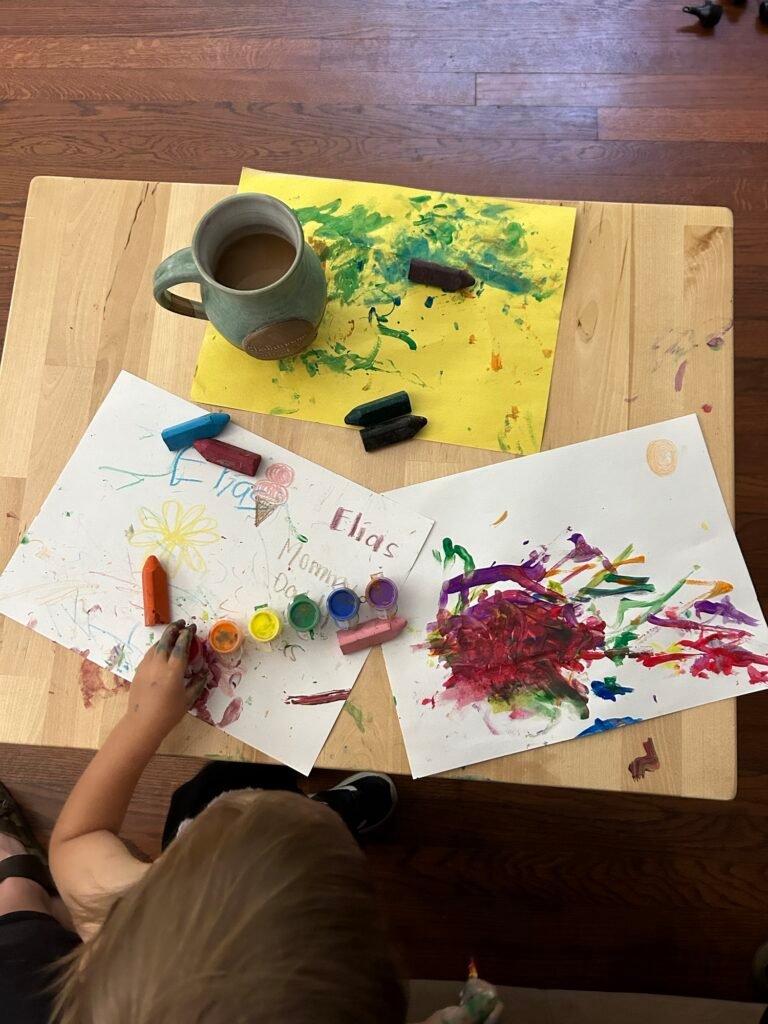 Another easy Montessori for Toddlers activity. My son is painting and coloring with washable utensils on a child-height table. 